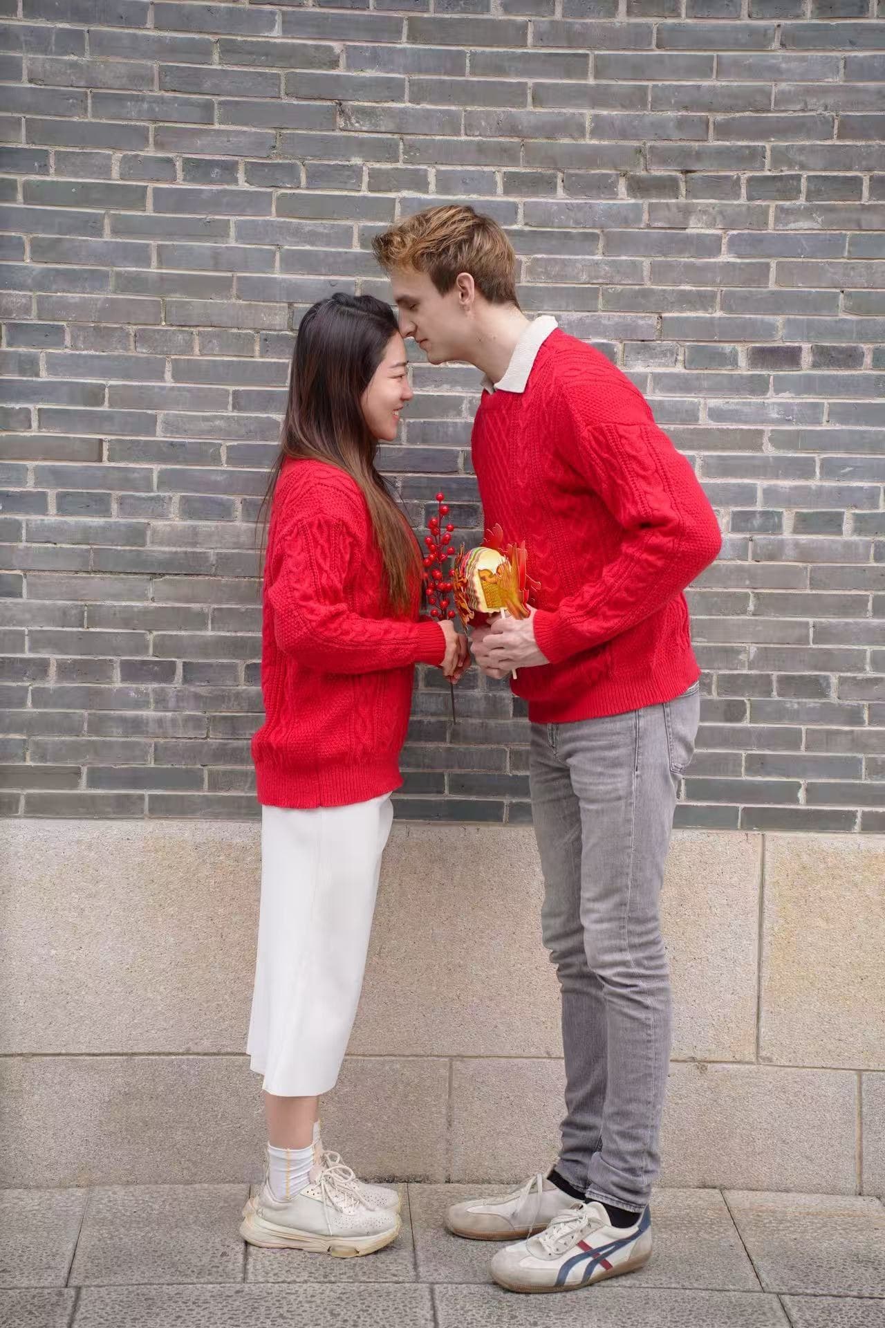 Eric and Linyang in matching red sweaters